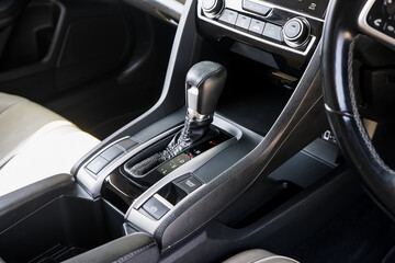 automatic transmission shift selector in the car interior. Closeup a manual shift of modern car gear shifter. 4x4 gear shift.