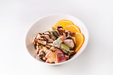 salad of fruits, apples, pears and oranges. on a white background