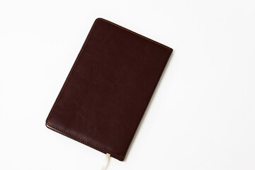 brown leather weekly on a white background