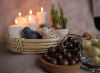 chocolate and caramel, round and delicious dessert standing in front of candlelight