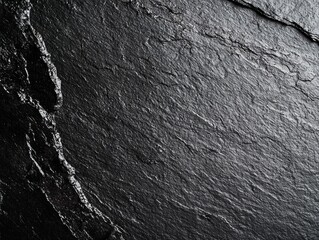 Textured black slate background for design.