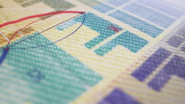 Extreme close-up of a colorful Swiss 10-franc banknote, Switzerland's national currency. Cash money with a sliding motion.