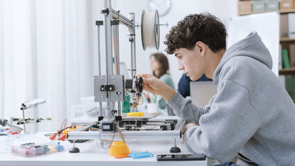 Student printing 3D prototypes in the lab