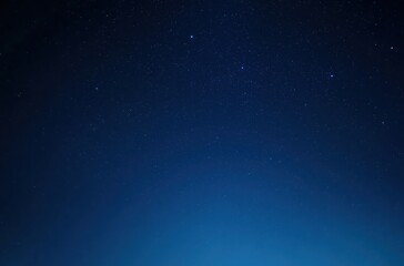 Fototapeta premium Serene Night Sky Illuminated by Distant Stars with Deep Blue Gradient 