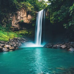 Fototapeta premium Lush rainforest waterfall cascading into turquoise pool