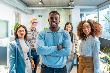 Confident business team smiling in coworking office