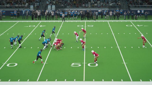Two American Football Teams Stand Across From Each Other on the Line of Scrimmage as the Ball is Passed to Start the Game. Gridiron Players Stand and Defend Positions When the Ball is Played