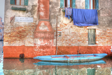 Venice Canal Brick Wall Laundry and Blue Boat