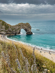 Durdle Door, famous rock bridge at the Jurassic Coast in Dorset, England, in summer.