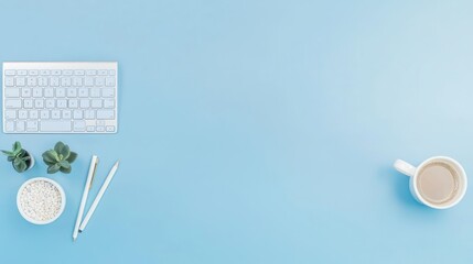 Organized Workspace With Keyboard Plant And Coffee Cup On Light Blue Background
