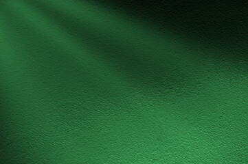 Green light rays on dark green background. Abstract green light background.