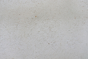 An old, uneven white cement surface.