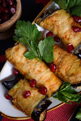 eggplant rolls stuffed with spicy pasta with nuts.