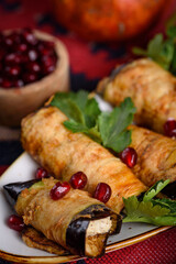 eggplant rolls stuffed with spicy pasta with nuts.