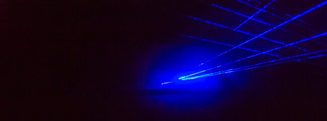 Abstract panorama background with bright blue laser rays