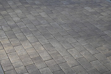 gray paving slabs as a background, pavement paved slabs as a background	
