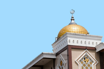 A stunning golden dome of mosque isolated with blue background, Ramadan kareem. 