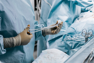 Close-up of medical instruments placed on the operating table in the operating room. Concept...
