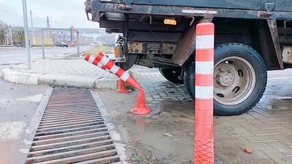 An unusual towing situation has arisen involving traffic cones in a busy urban area today