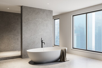 Minimalist bathroom interior with modern freestanding tub in bright space. 3D Rendering
