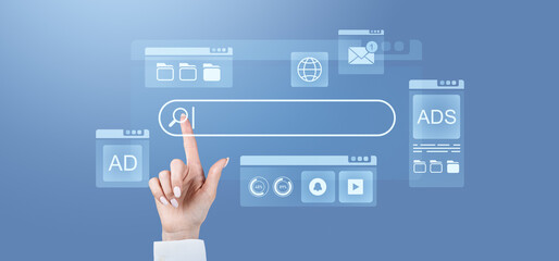 Concept of internet search with hand pointing on search bar in blue digital interface.