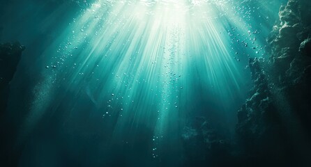 Underwater sunbeams, bubbles, and dark ocean.