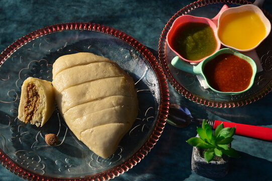 Siddu or sidu is a Himachali dish.fermented steamed bread made from wheat flour stuffed with fillings like urad dal (black lentils) walnut and herbs etc .served with desi ghee and chutney.