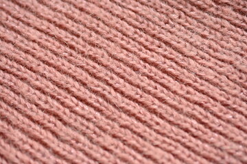 texture of knitted pastel pink sweater, close-up texture of beige pink knitted fabric, macro texture of tan knitted woolen clothes