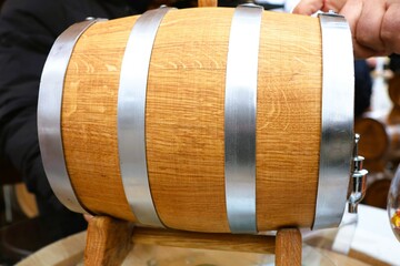 A beautifully handcrafted wooden barrel featuring durable metal bands for added strength