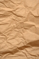 light brown crumpled paper texture as background, old kraft paper as background, crumpled packing material texture as background photo above