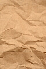 old kraft paper as background, crumpled packing material texture as background photo above, light brown crumpled paper texture as background, 