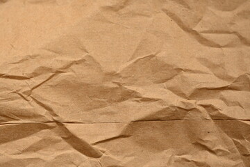 old kraft paper as background, crumpled packing material texture as background photo above, light brown crumpled paper texture as background, 
