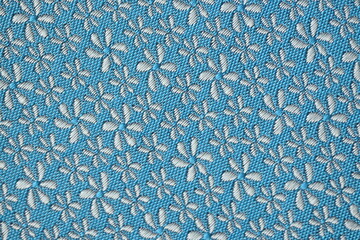 blue silk background with white flowers, macro silk fabric,  