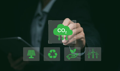Reduce co2 emission. man using software to lower CO2 emissions to limit global warming and climate...