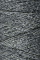 Fototapeta premium geometric lines of woolen threads, texture of woolen grey threads, goods for needlework and hobbies 