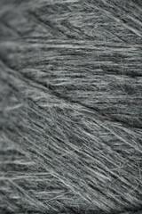 geometric lines of woolen threads, texture of woolen grey threads, goods for needlework and hobbies   