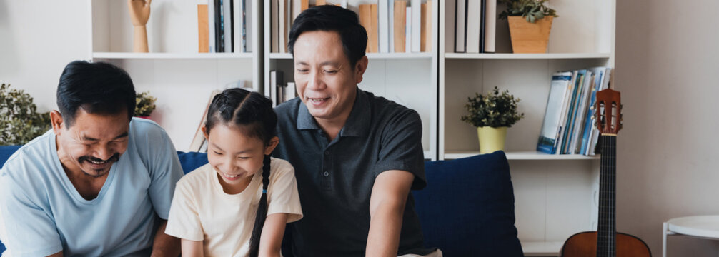 Three family members joyfully engaging in a bonding activity in a cozy living room, promoting inclusivity and love