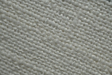 white woven fabric macro as background, white woven texture, texture of white knitted fabric, fine knitting