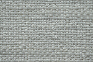 white woven fabric macro as background, white woven texture, texture of white knitted fabric, fine knitting