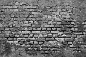 gray background, photo shows texture of old brick wall and plaster