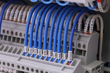 Fototapeta premium Marking of electrical wires using thermal printing on vinyl tape.