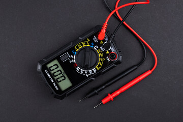 Digital multimeter on dark background