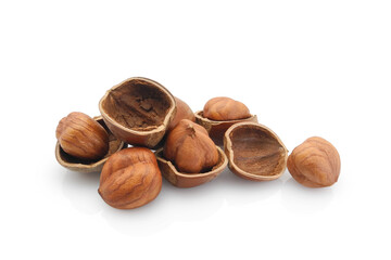 Split hazelnuts and nut shell halves isolated on white background
