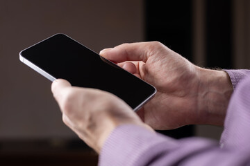 businessman working at the office for investment analyzing company financial report balance with smart phone.