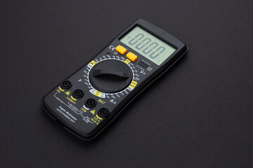 Digital multimeter on dark background