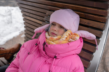 Cozy Moments of Winter A Child Wearing an Adorable Pink Puffer Jacket in the Snowy Landscape