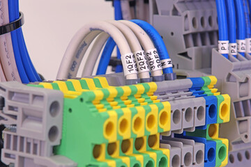 Electrical screw terminals for connecting wires in an electrical switchboard. Soft focus. Close-up.