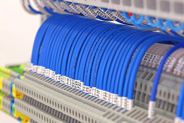 Electrical screw terminals for connecting wires in an electrical switchboard. Soft focus. Close-up.