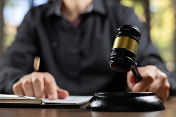 Judge is prepared gavel in the courtroom to be used to give a signal.