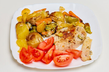 Portion of Pork Chop with Mediterranean Vegetables on a Plate
